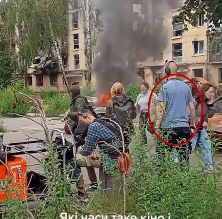 Russian propaganda uses footage from a film set to spread disinformation - Keyframe with movie crew summer cloths